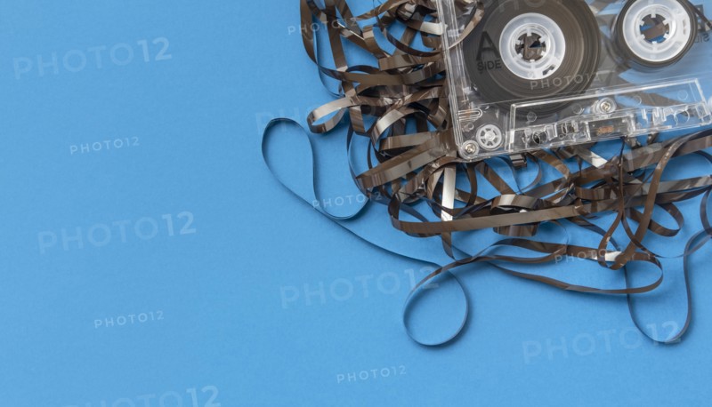 Analog audio cassette on blue background