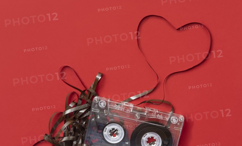 Analog audio cassette on red background