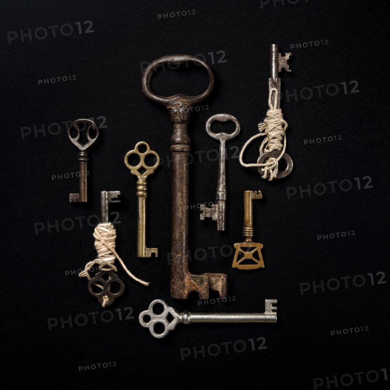 Antique keys on black background