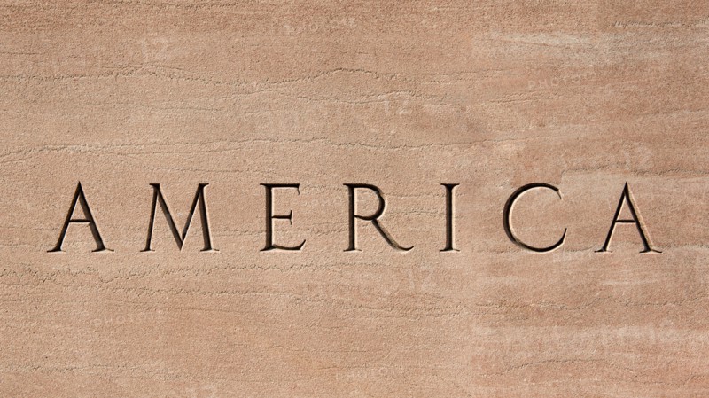 Word America engraved into stone surface