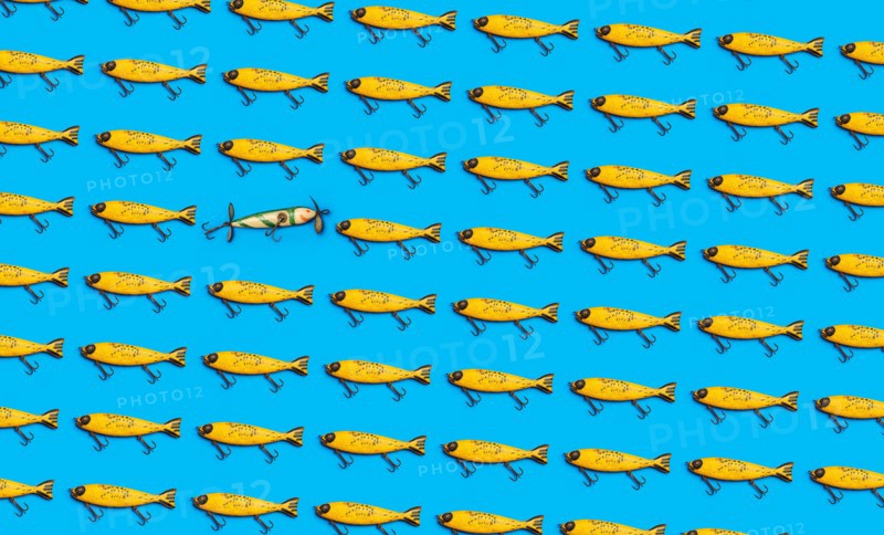 Vintage fishing lures on blue background
