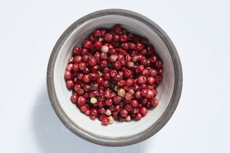 Red peppercorns in bowl
