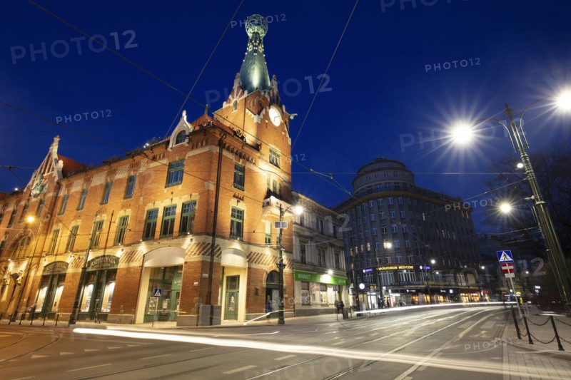 Poland, Lesser Poland, Krakow, Illuminated street and buildings in historic city district