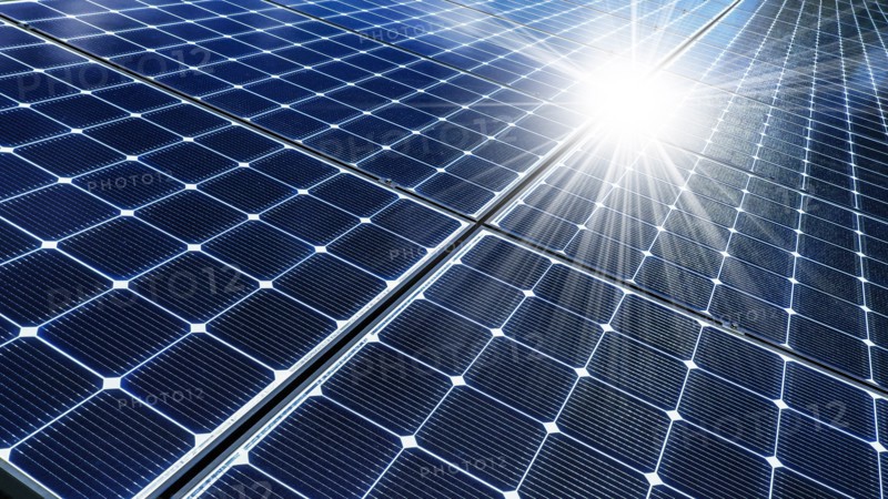 Close-up of solar panels reflecting sun