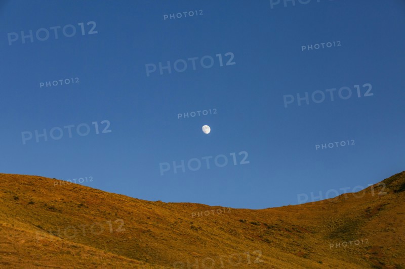 USA, Idaho, Sun Valley, Rising moon over mountain