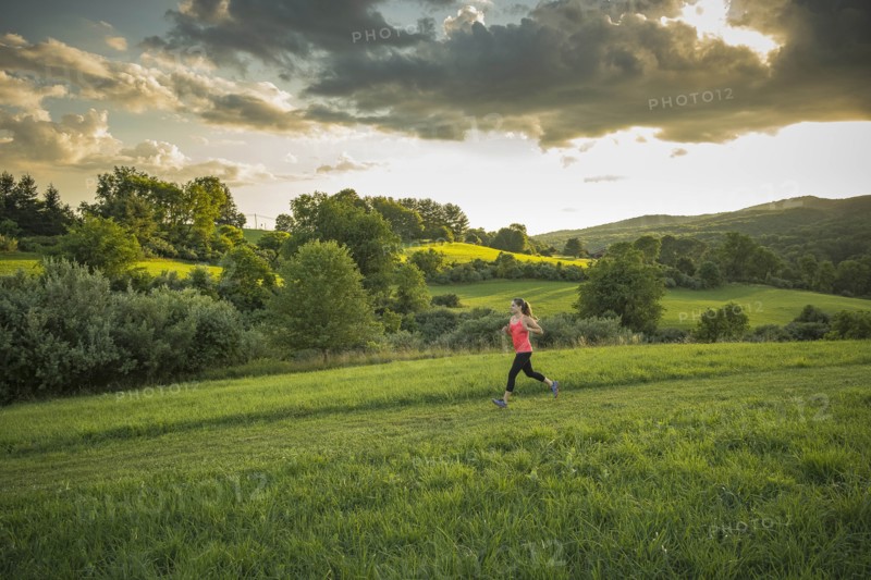 USA, Woman running in field