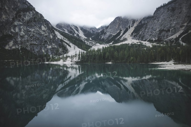 Italy, Pragser Wildsee, Dolomites, South Tyrol, Mountain range reflecting in lake