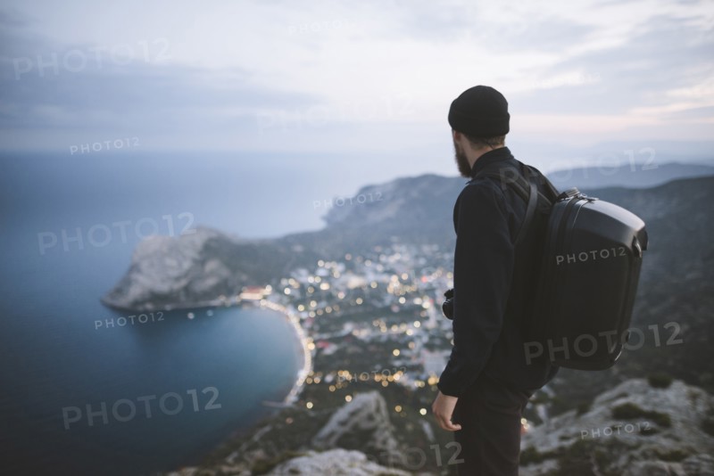 Italy, Liguria, La Spezia, Man looking at mountain range from mountain top
