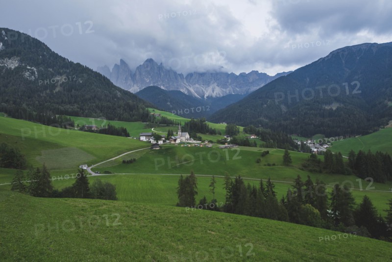 Italy, South Tyrol, Funes, Santa Magdalena, Landscape with village in valley