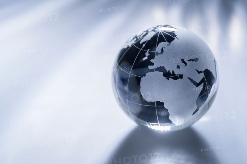 Glass globe on gray background