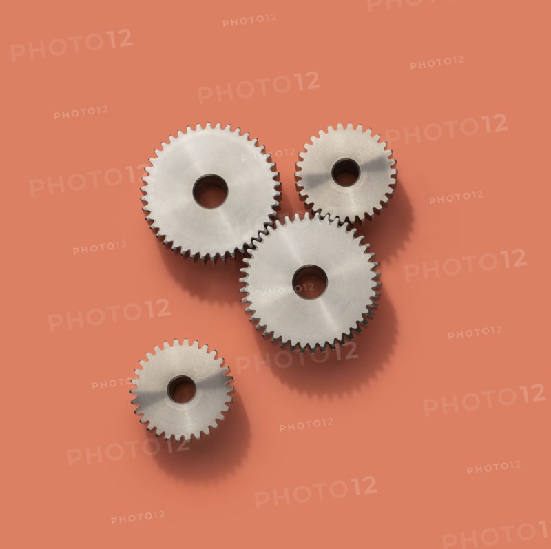 Cog wheels on pink background