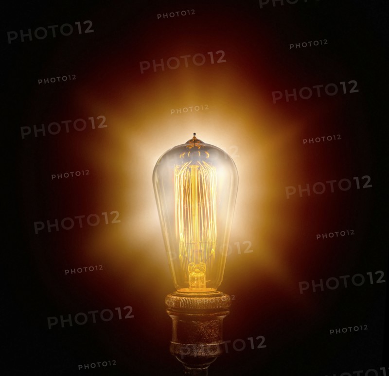 Edison light bulb on black background