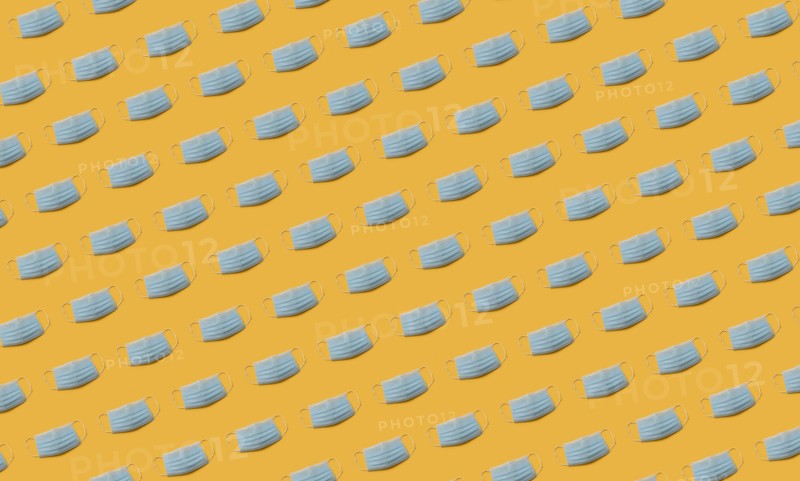 Flu masks on orange background