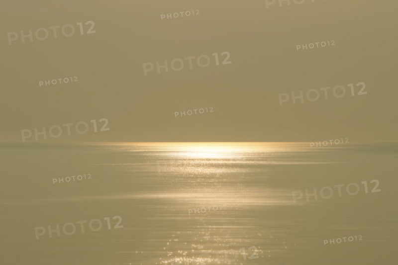 Calm sea and sky with sunlight