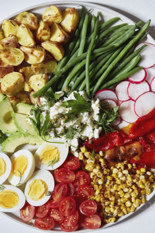 Colorful vegetables, salad and eggs on plate