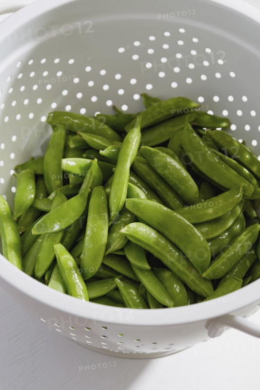 Green peas in colander