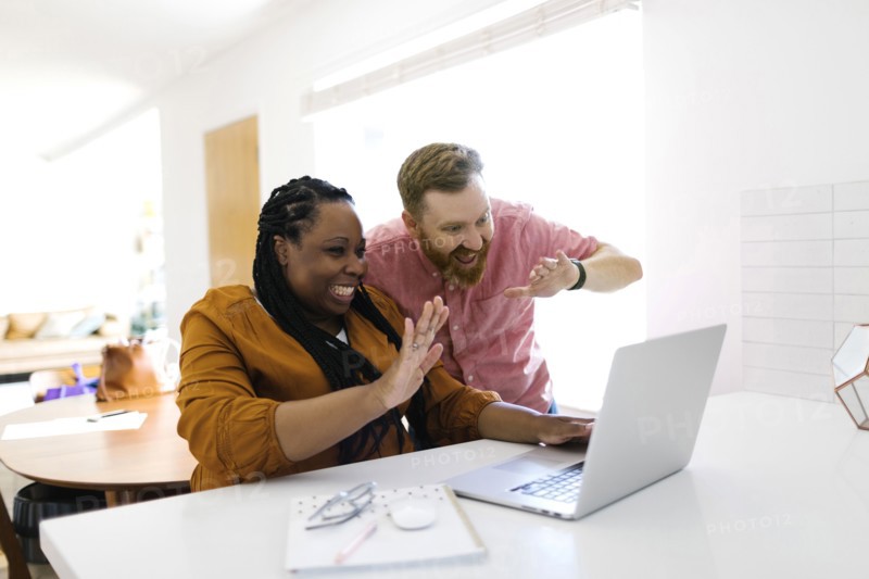 Man and woman during zoom call at home