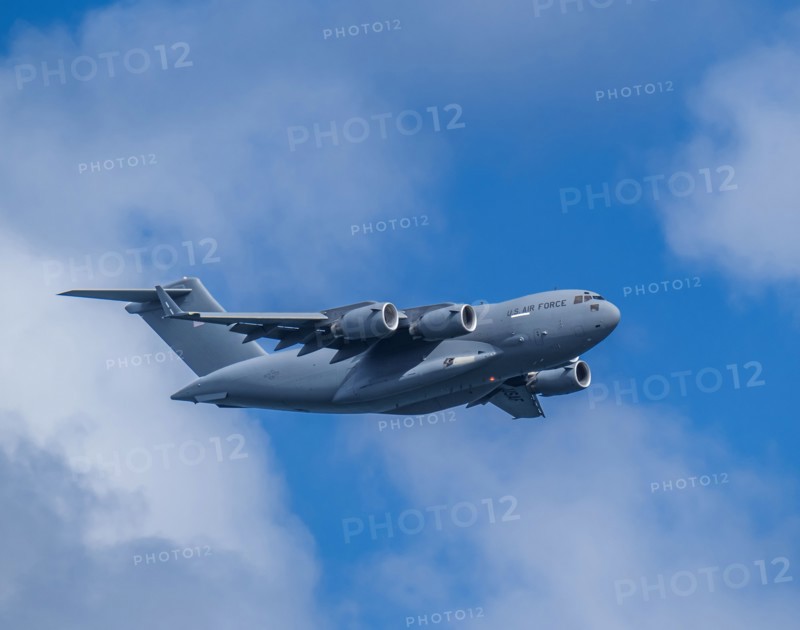 McDonnell Douglas/Boeing C-17 Globemaster III American Air Force cargo plane flying against sky