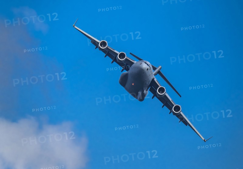 McDonnell Douglas/Boeing C-17 Globemaster III American Air Force cargo plane flying against sky