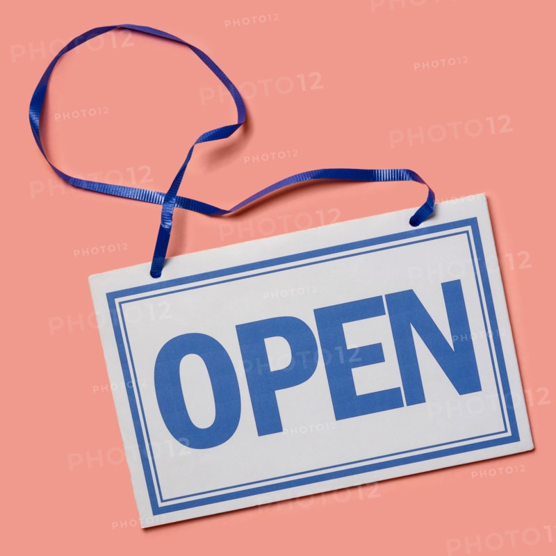 Studio shot of Open sign on pink background
