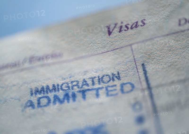 Close-up of immigration visa in passport