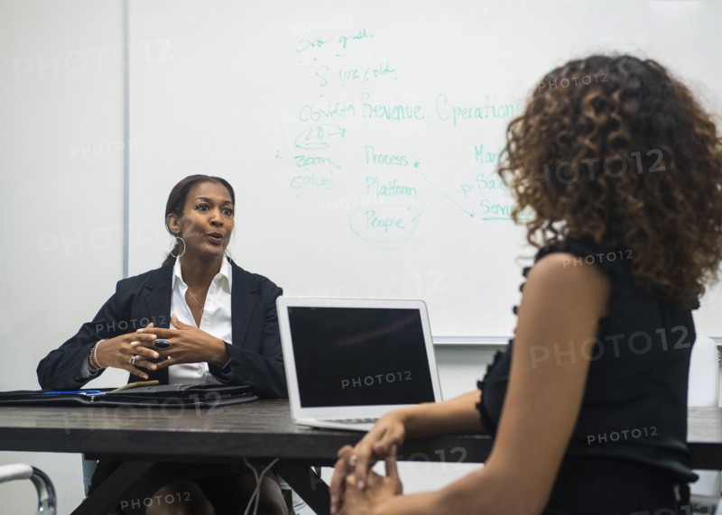 Two businesswomen working in office