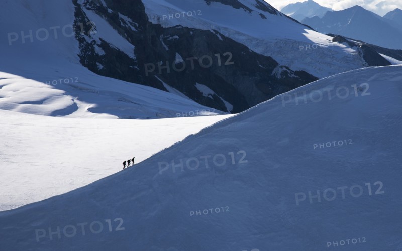Climbers on mountain ridge at Monte Rosa Massif