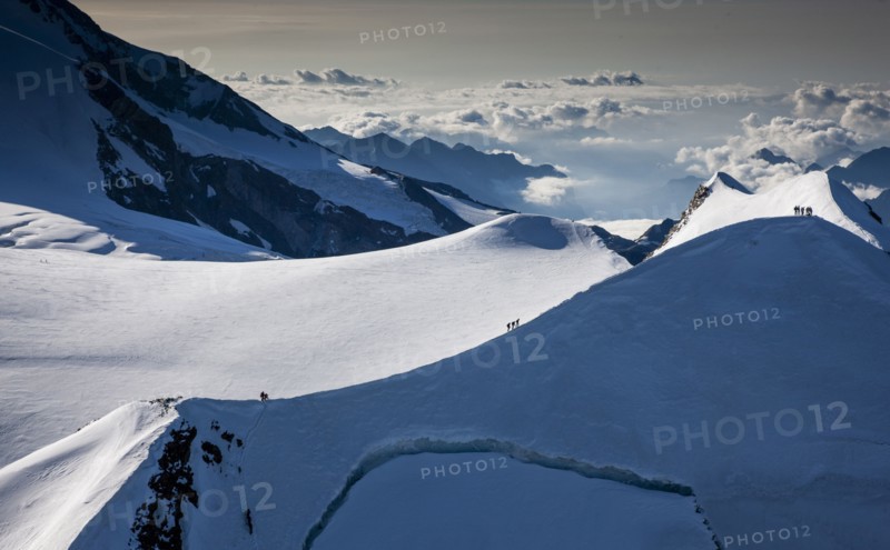 Climbers on mountain ridge at Monte Rosa Massif