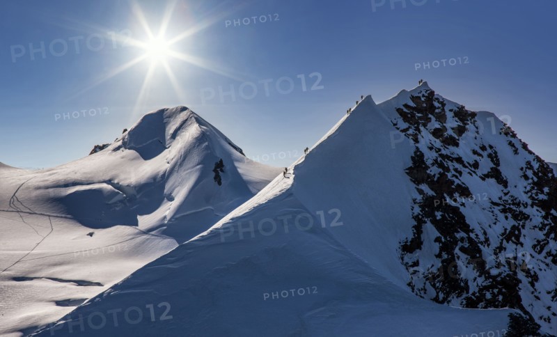 Climbers on mountain ridge at Monte Rosa Massif