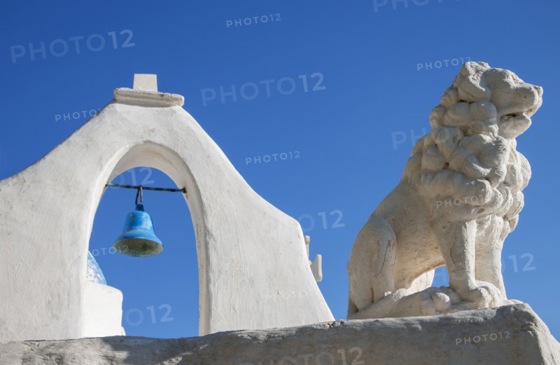 Bell tower and lion statue of Paraportiani Orthodox Church