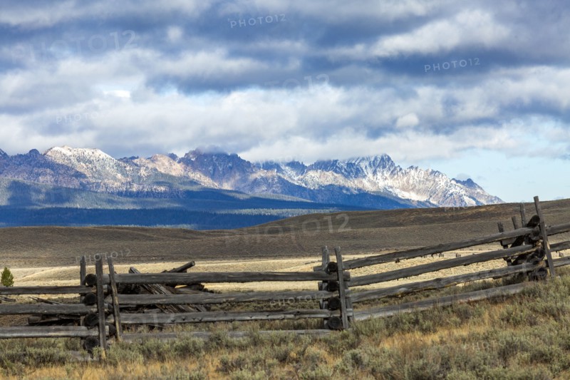 Ranch landscape with mountains and clouds