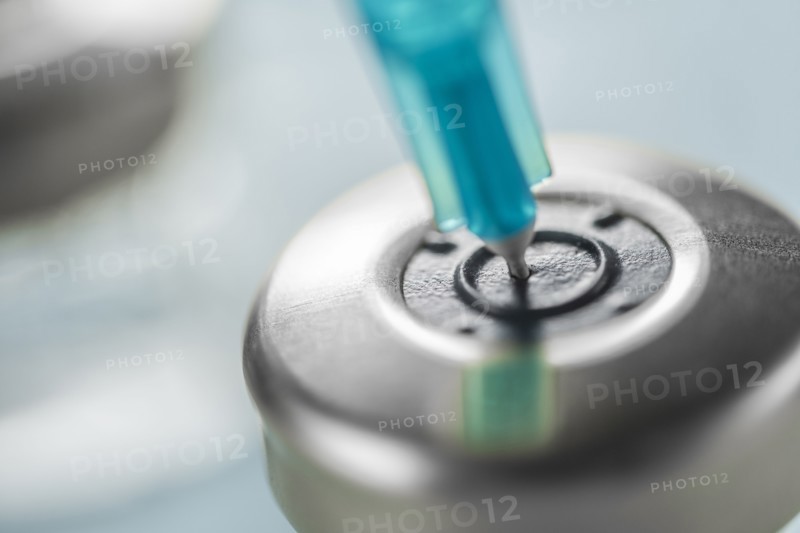Close-up of Covid-19 vaccine and syringe
