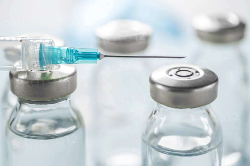 Close-up of Covid-19 vaccine and syringe