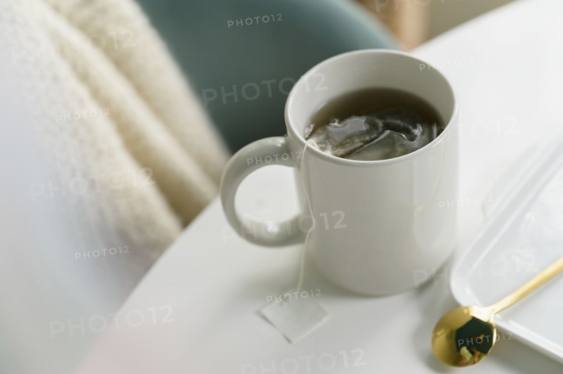 Mug with tea on table
