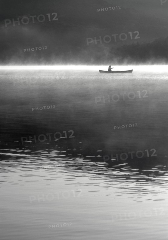 Woman canoeing on Lake Placid Lake
