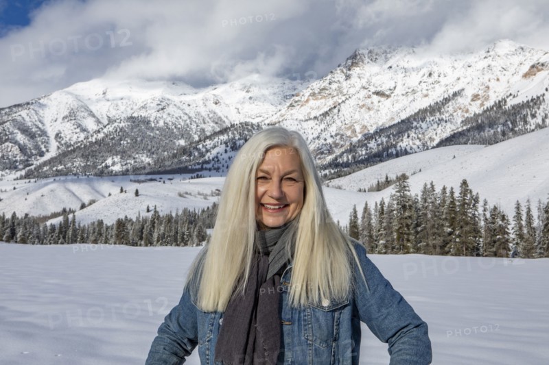 Winter portrait of senior woman in front of Boulder Mountains