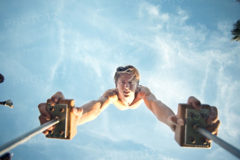 Caucasian man doing handstand