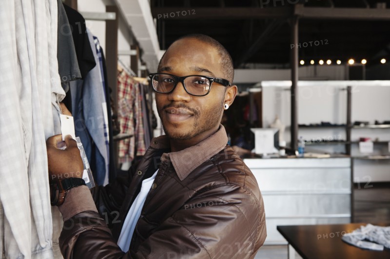 African American man shopping in clothing store