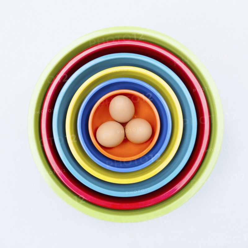 Eggs in colorful nesting bowls