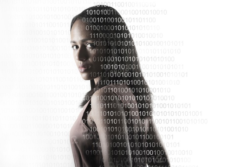 Portrait of woman with superimposed binary numbers
