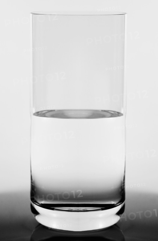 Studio shot of  glass half full concept
