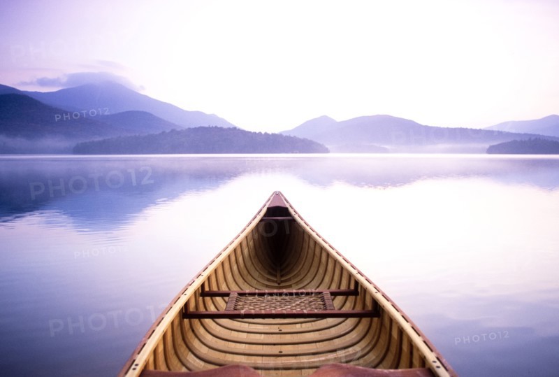 View of Whiteface Mountain from wooden canoe on Lake Placid