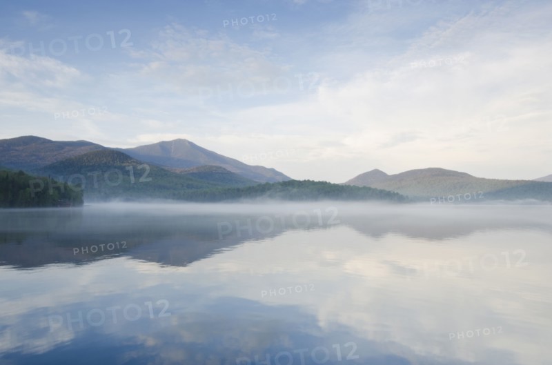 Calm surface of Lake Placid and Whiteface Mountain