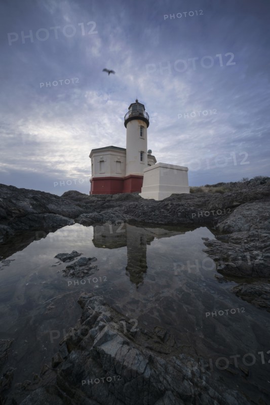Coquille River Lighthouse reflecting in water