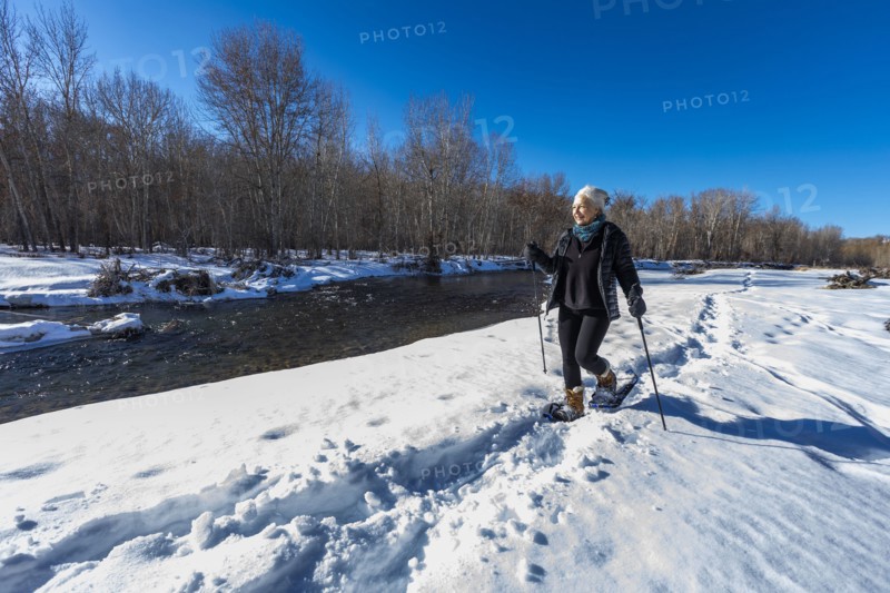 Senior woman snowshoeing