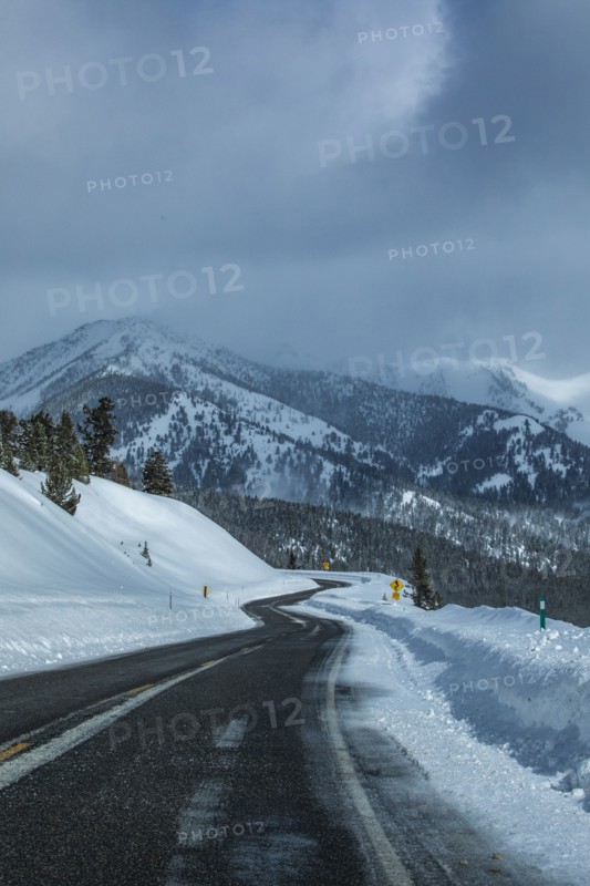 Road through snowy mountains