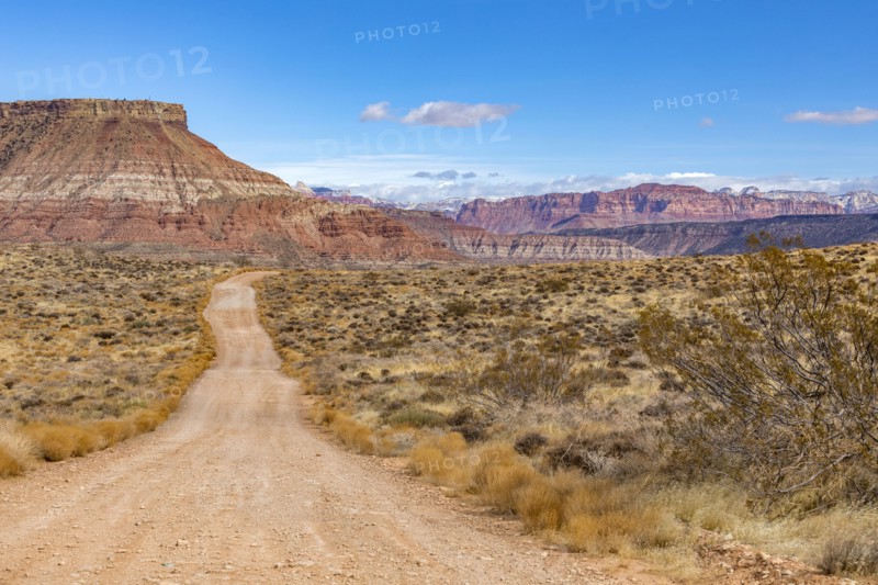 Dirt road across desert landscape near Zion National Park