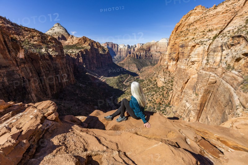 Senior woman at overlook above Zion Canyon in Zion National Park