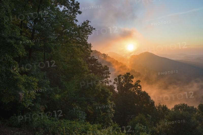 Misty sunrise in mountains