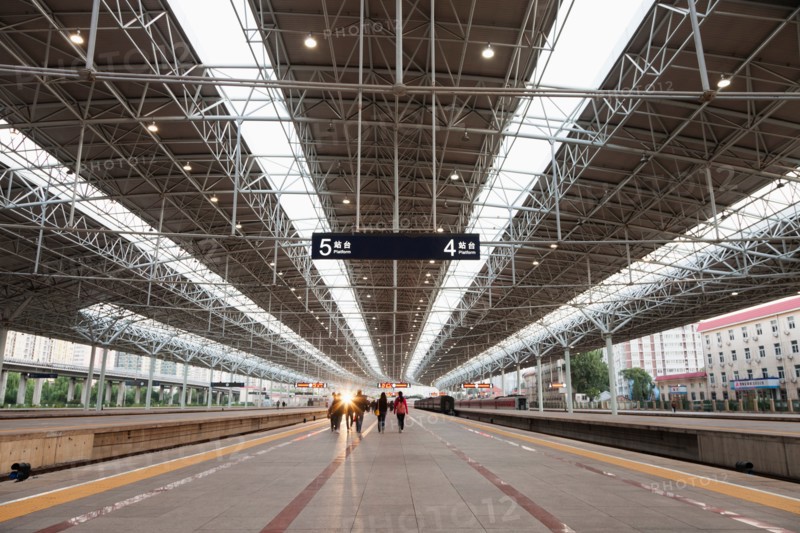 People on Beijing train station platform